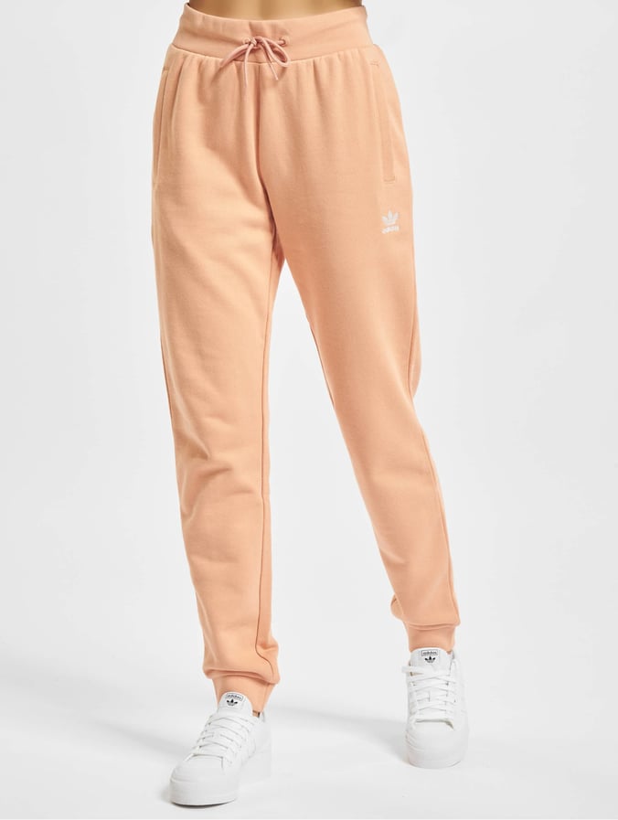 Slager Luidruchtig vernieuwen adidas Originals broek / joggingbroek Adicolor Essential Slim in oranje  833668