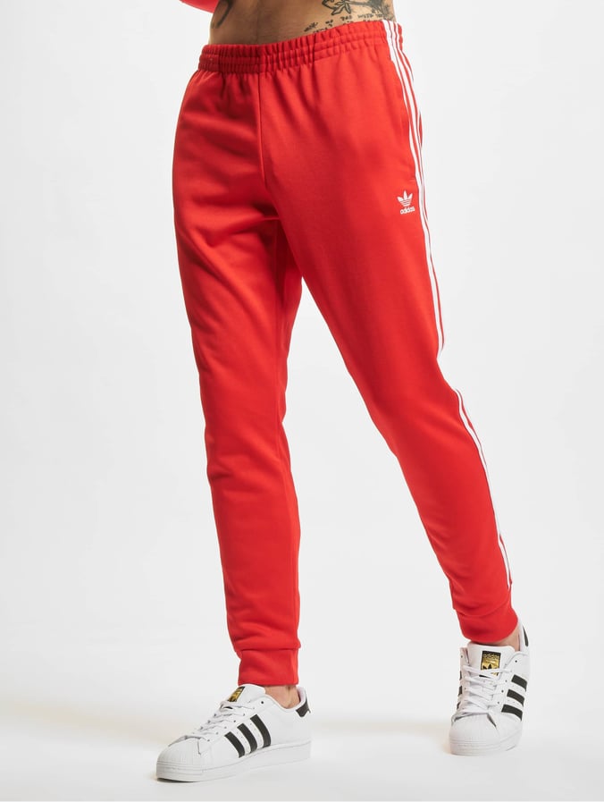 Tijdens ~ Plak opnieuw Vuil adidas Originals broek / joggingbroek Originals SST Blue in rood 872517