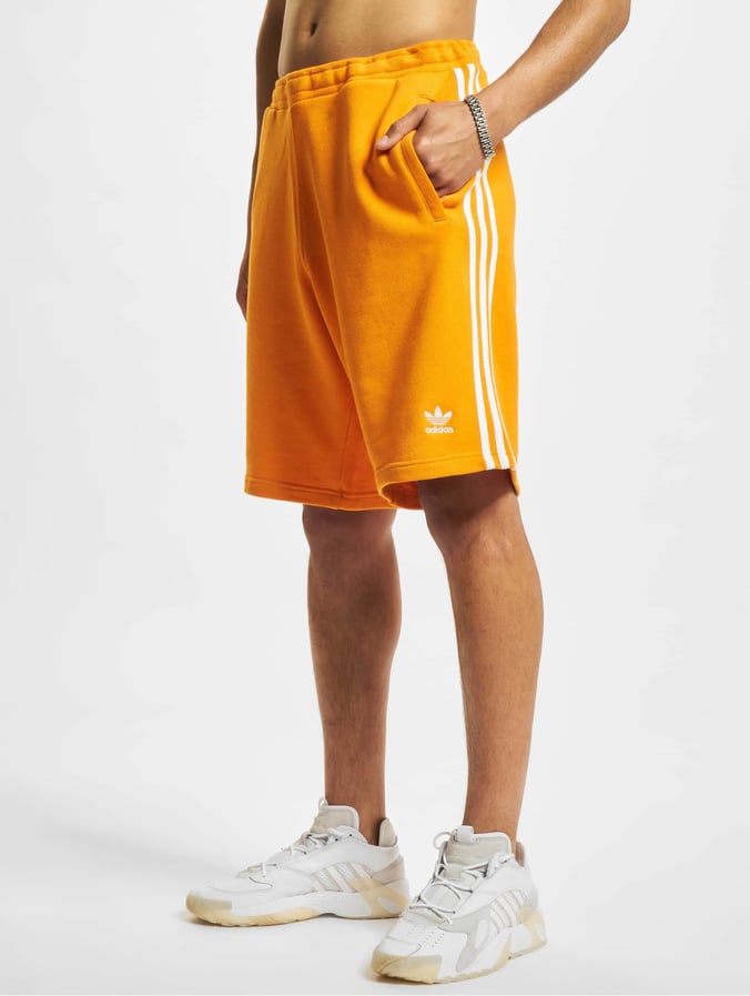 Karakteriseren achtergrond Verenigen adidas Originals broek / shorts 3-Stripe in oranje 891078