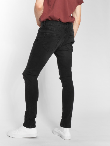 Urban Classics / Slim Fit Jeans Knee Cut in zwart