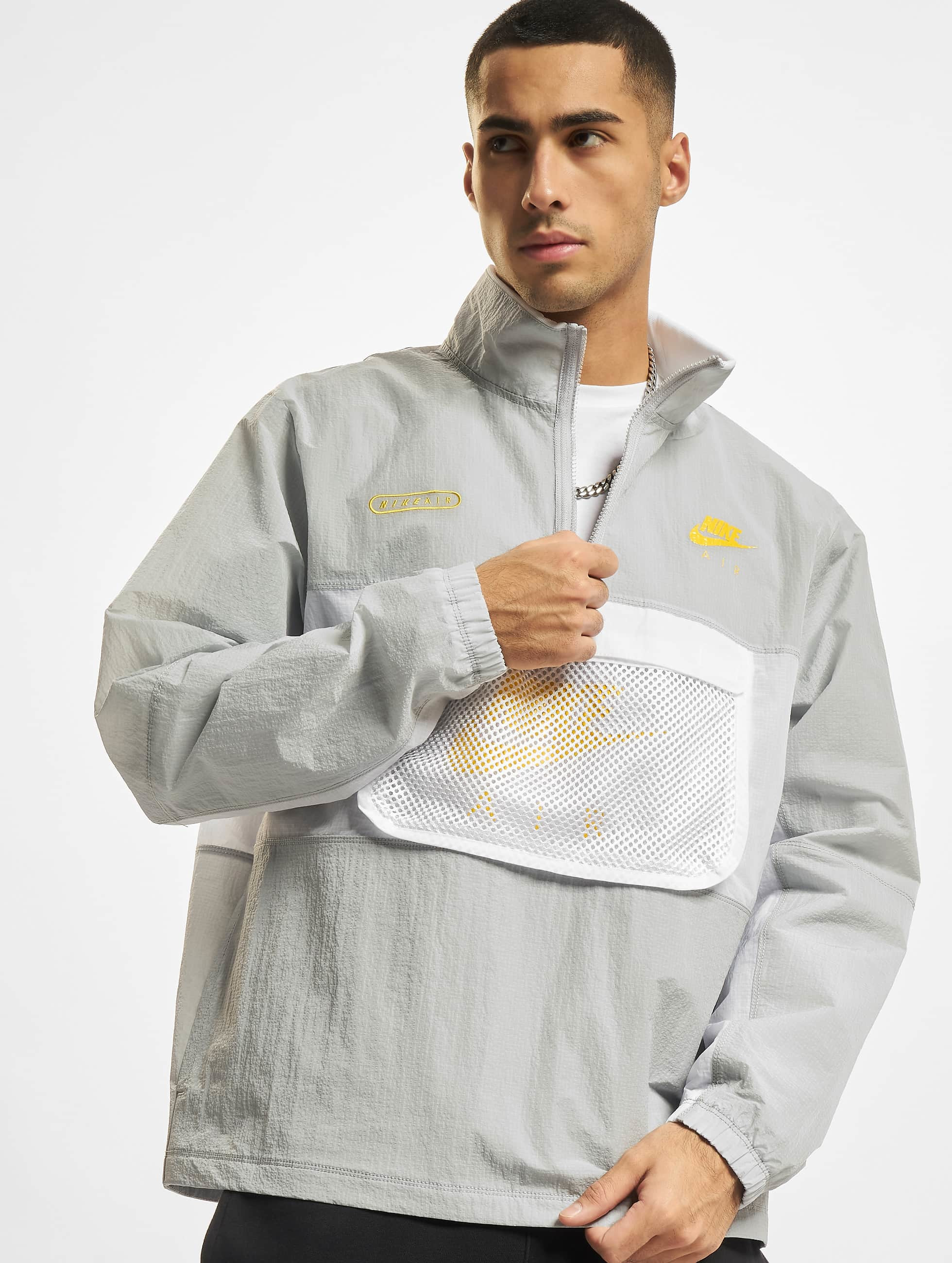 Matron moeilijk tevreden te krijgen Spotlijster Nike jas / Zomerjas Air Woven Lined in grijs 876189
