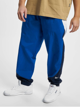 Reebok Spodnie do joggingu Train Woven niebieski