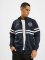 UNFAIR ATHLETICS Veste mi-saison légère DMWU Tracktop bleu