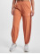 New Balance Látkové kalhoty All Terrain Hose oranžový