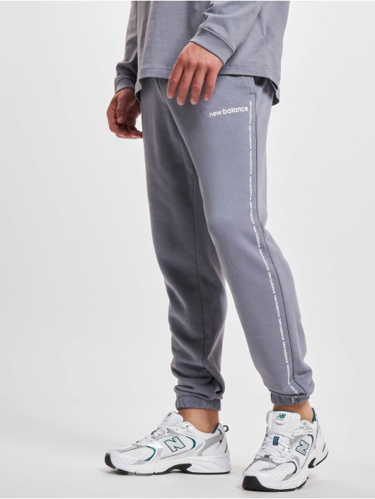 New Balance Jogging kalhoty Essentials Fleece šedá