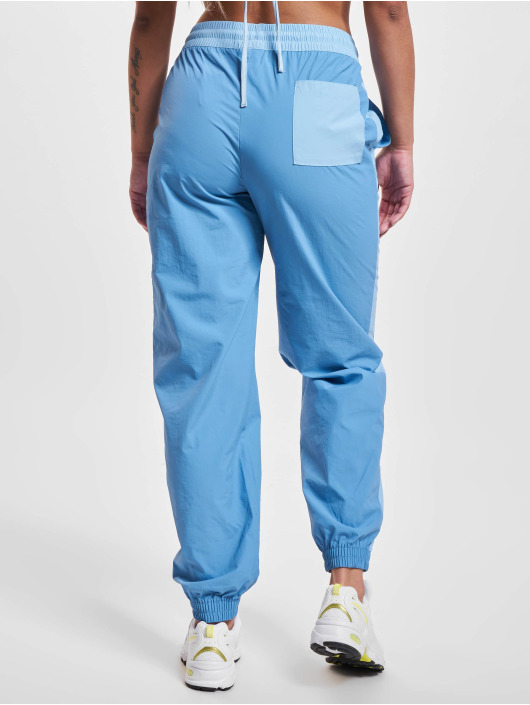 New Balance joggingbroek Athletics Woven blauw