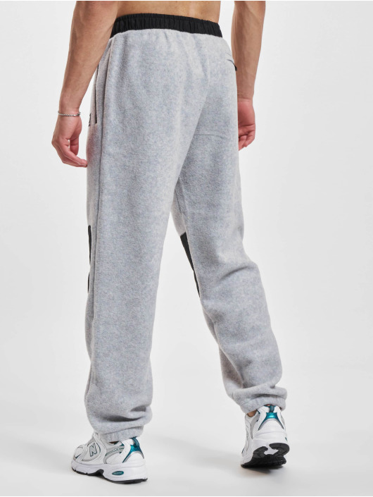 New Balance Pantalón deportivo At Spinnex gris