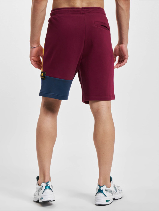 New Balance Shortsit Athletics Higher Learning punainen