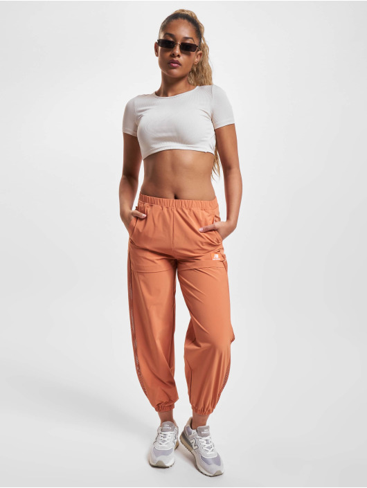 New Balance Tygbyxor All Terrain Hose apelsin