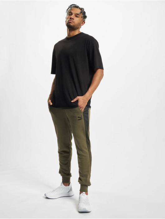 Puma Spodnie do joggingu Between The Lines T7 oliwkowy