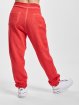 Urban Classics Spodnie do joggingu Spray Dye pomaranczowy