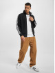 adidas Originals Chaqueta de entretiempo Fbird negro
