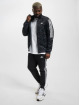 adidas Originals Välikausitakit Tiro harmaa