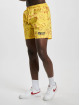 Karl Kani Shortsit Signature Smiley® Resort keltainen