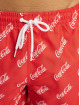 Merchcode Kúpacie šortky Coca Cola Logo All Over Print èervená