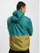 New Balance Chaqueta de entretiempo At Woven beis