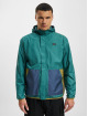 New Balance Chaqueta de entretiempo At Woven beis