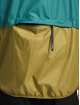 New Balance Chaqueta de entretiempo At Woven beis