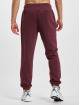 New Balance Joggingbyxor Essentials Stacked Rubber Pack röd