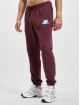 New Balance Joggingbyxor Essentials Stacked Rubber Pack röd