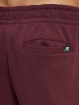 New Balance Joggingbyxor Essentials Stacked Rubber Pack röd