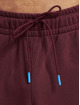 New Balance Joggingbyxor Essentials Stacked Rubber Pack röd