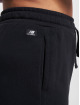 New Balance Joggingbyxor Essentials svart