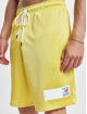 New Balance Pantalón cortos Essentials Mesh amarillo