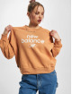 New Balance Puserot Essentials Graphic Fleece ruskea