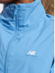 New Balance Veste mi-saison légère Athletics Woven bleu