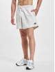 New Balance Šortky Essentials Uni-Ssentials New béžový