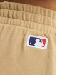 New Era Spodnie do joggingu MLB New York Yankees League Essentials Relaxed bezowy