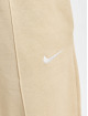 Nike tepláky Essentials Clctn Flc Mr béžová