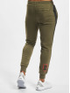 Puma Spodnie do joggingu Between The Lines T7 oliwkowy