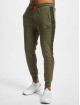 Puma Spodnie do joggingu Between The Lines T7 oliwkowy