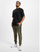 Puma Spodnie do joggingu Between The Lines T7 oliwkowy