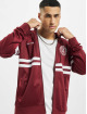 UNFAIR ATHLETICS Veste mi-saison légère DMWU Tracktop rouge