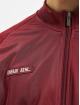 UNFAIR ATHLETICS Veste mi-saison légère DMWU Tracktop rouge