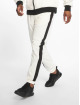 Urban Classics Spodnie do joggingu Side Striped Crinkle bialy