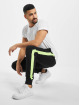 Urban Classics Spodnie do joggingu Neon Striped czarny