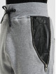 Urban Classics Spodnie do joggingu Side Zip Leather Imitation szary